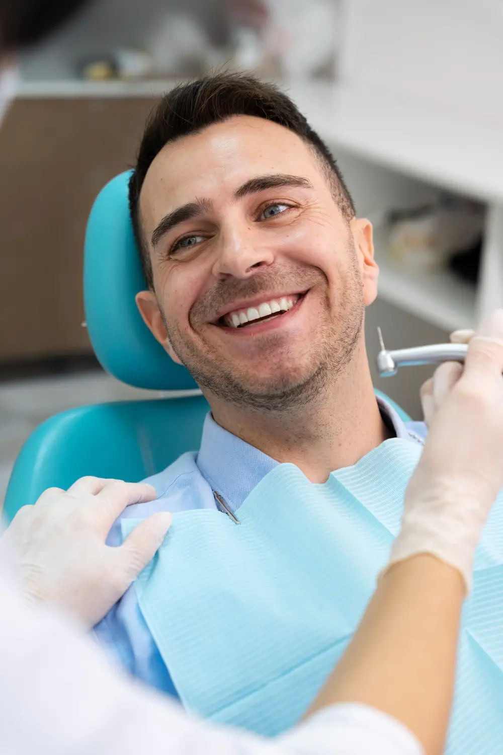 a man smiling at the dentist | Nashville Dentures and Implants.