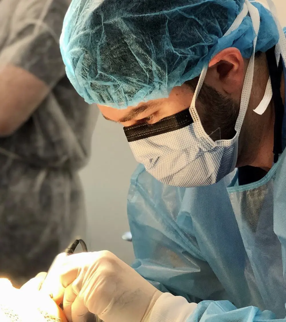 Dentist working on a patient. Nashville Dentures and Implants.